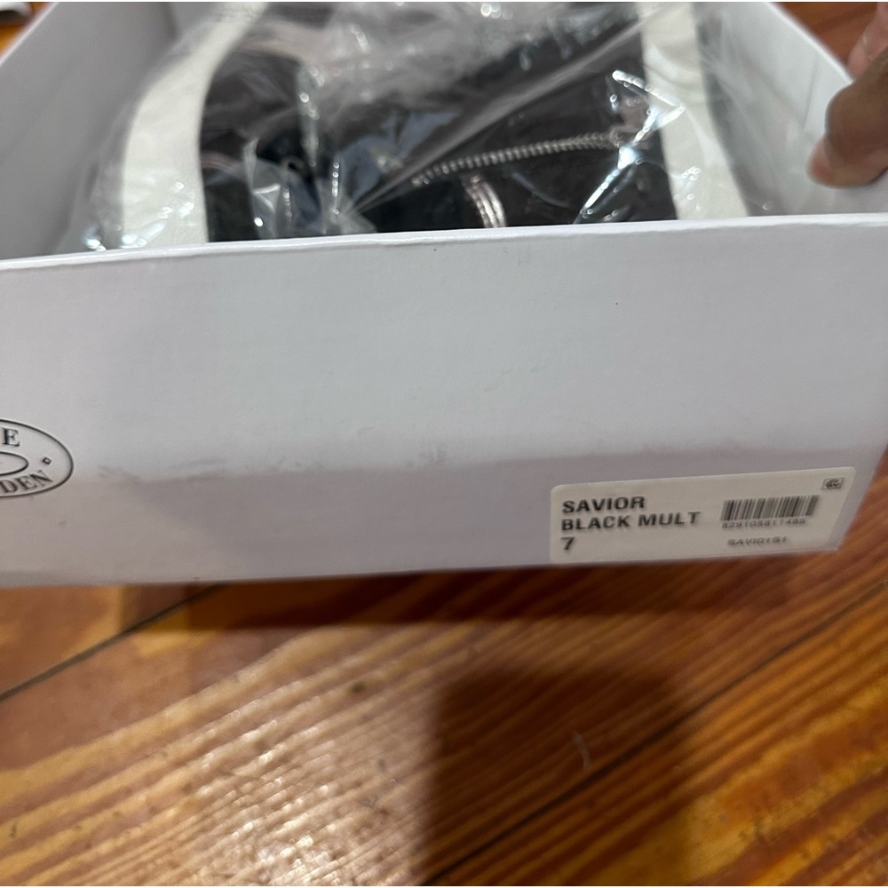 Steve Madden black high top sneaker. Never worn, in box.